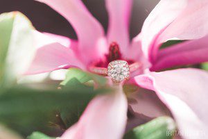 rose gold engagement ring in pink flower close up