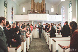father walking bride down the aisle church wedding ceremony