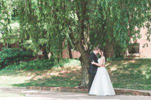 bride and groom under tree summer wedding