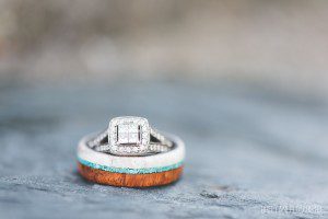 groom wooden wedding band halo engagement ring close up