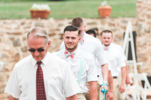 groom and groomsmen summer outdoor wedding ceremony cobblestone courtyard