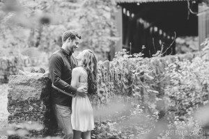 engaged couple by covered bridge philadelphia