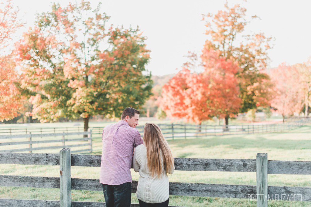 Fall engagement at a Farm with colored leaves