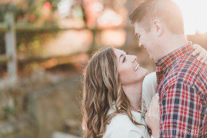 engaged couple laughing outdoor natural light engagement shoot