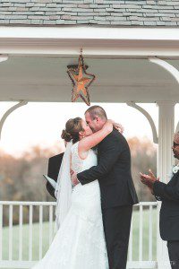 groom kissing bride morningside inn wedding ceremony