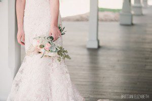 ivory wedding dress bride holding bouquet