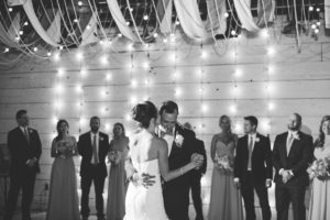 black and white bride and groom dance