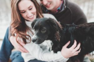 engaged couple with their dog lancaster winter engagement