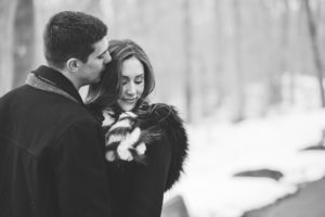 snowy winter engagement couple black and white winter engagement lancaster