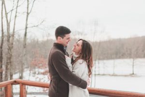 engaged couple hugging winter engagement lancaster