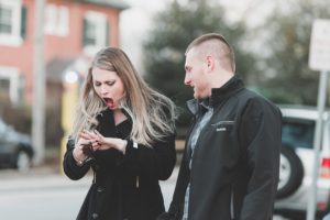 surprise engagement ring engaged couple west chester university campus proposal