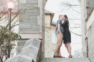 engaged couple nuzzling at west chester university campus