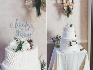 white wedding cake winter roses pinecones