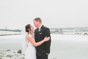 bride and groom smiling outside winter wedding elizabethtown