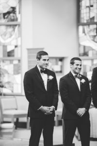 black and white groom waiting for bride at wedding ceremony