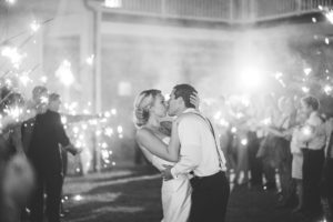 black and white bride and groom sparkler send off