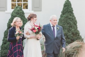 parents walking bride down aisle outdoor wedding ceremony