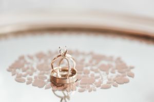 gold wedding bands close up on tray