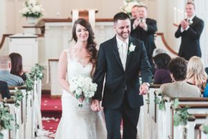 bride and groom exit wedding ceremony emmaus moravian church