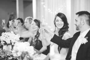 black and white wedding toast candid