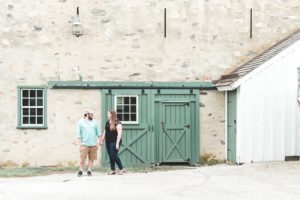 engaged couple in front of barn valley forge engagement