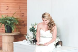 bride reading card from groom sussex conservatory wedding