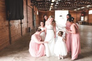 bride getting ready with bridesmaids and flower girl