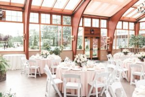 natural lighting rustic wedding reception large windows wooden beams
