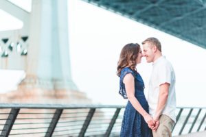engaged couple by benjamin franklin bridge philadelphia engagement