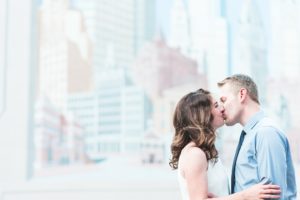 engaged couple kissing old city philadelphia engagement