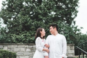 engaged couple embrace summer engagement at longwood gardens