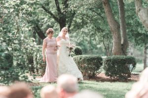 mother walking her daughter down the aisle
