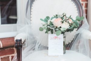 wedding flowers invitation jewelry veil detail shot