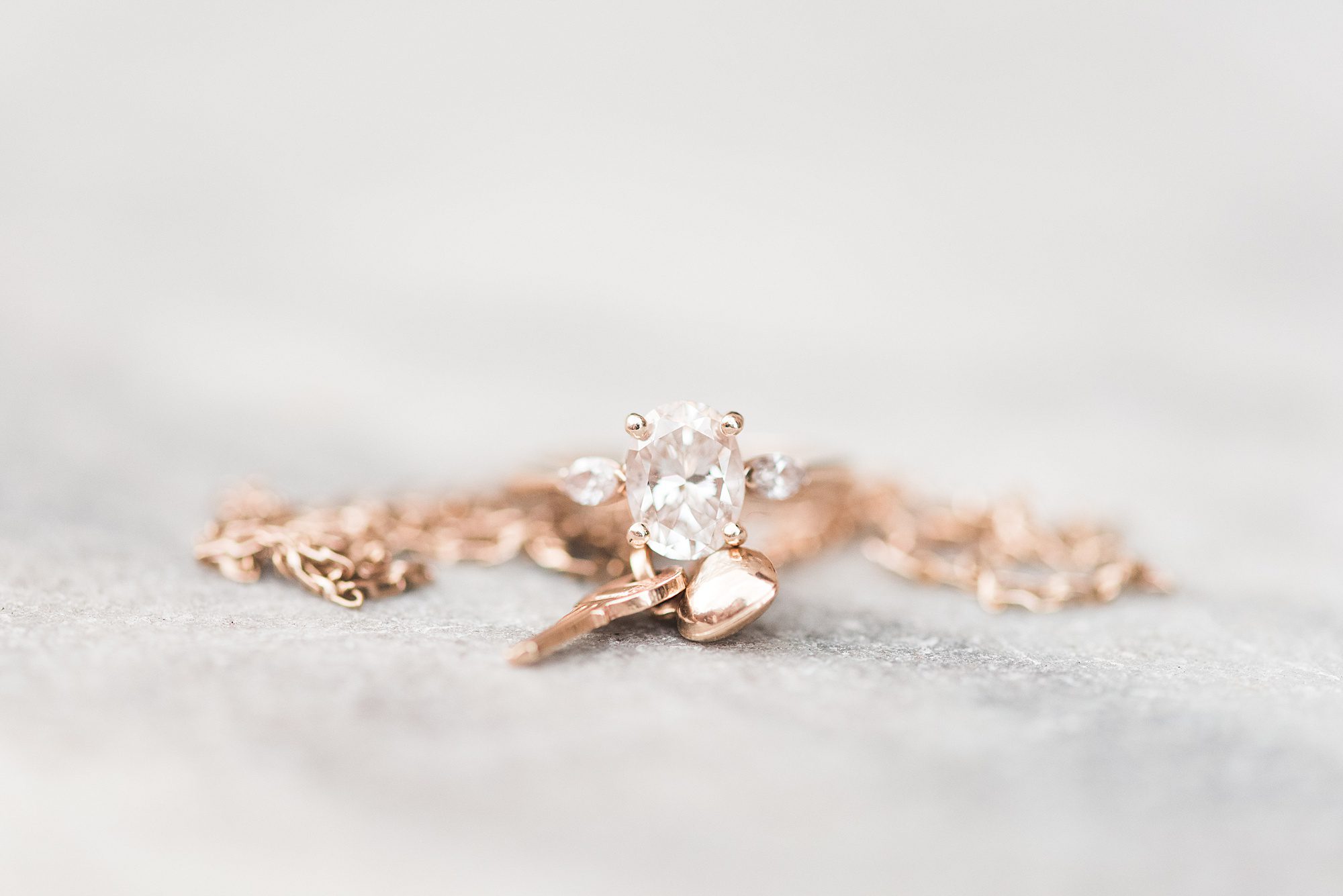 Yellow Gold oval engagement ring with side stones