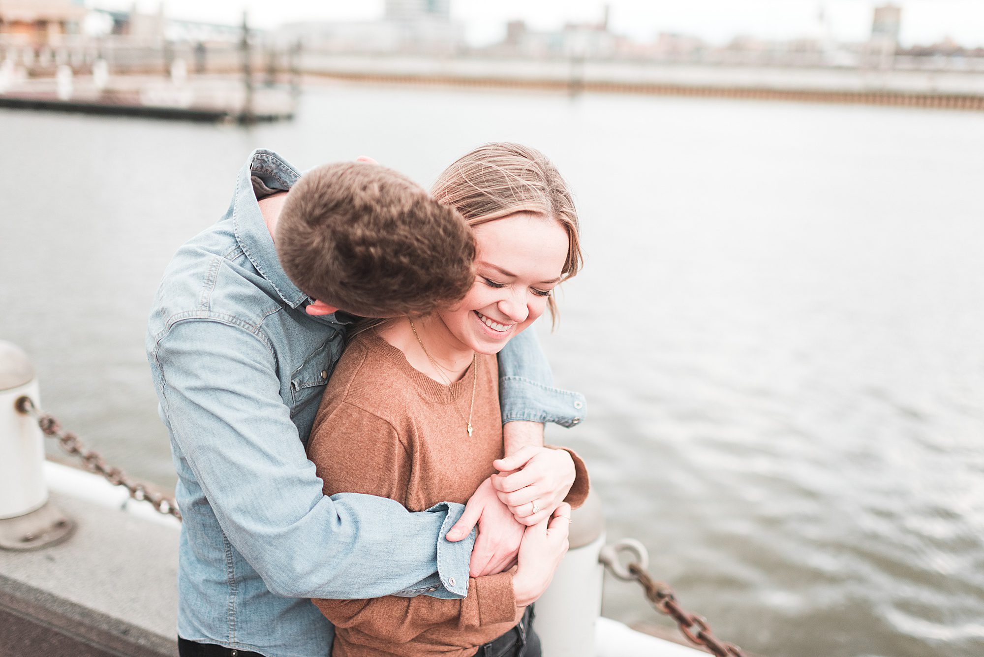 Couple hugs by the water at Spruce Street Harbor Park