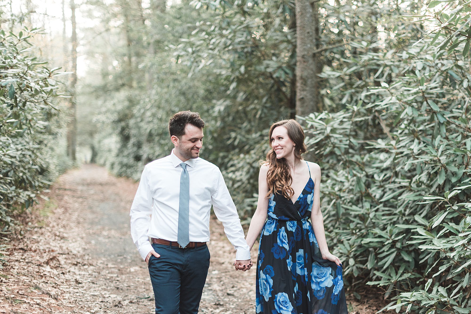 Engaged couple wanders in woods during engagement session in Jim Thorpe, Pennsylvania